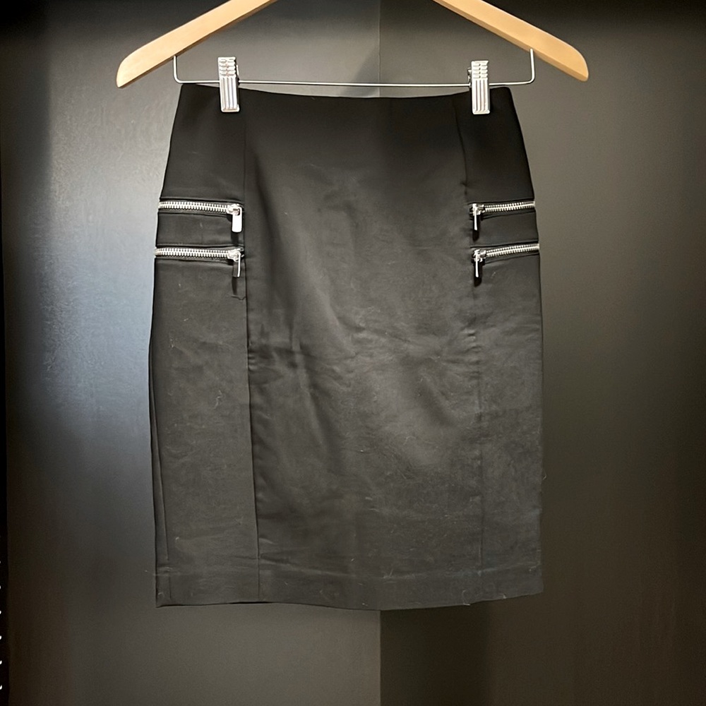 Sleek black pencil skirt with zipper embellishments
